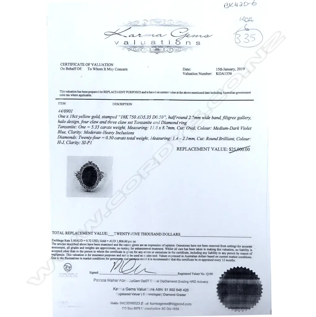 An 18ct gold tanzanite and diamond halo ring Image 1++