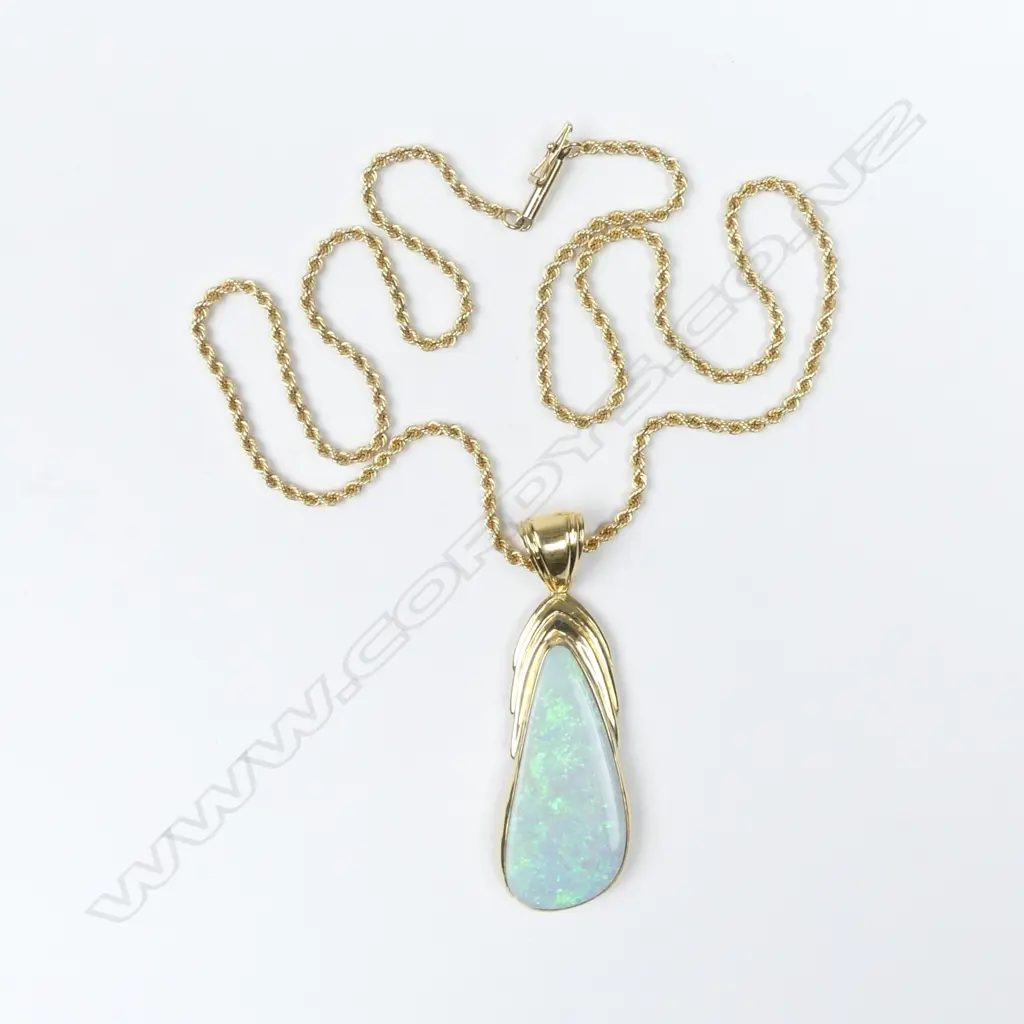 An 18ct gold and opal pendant Image 1++