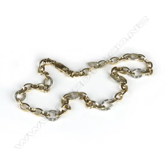 A 9ct yellow and white gold diamond set fancy link necklace