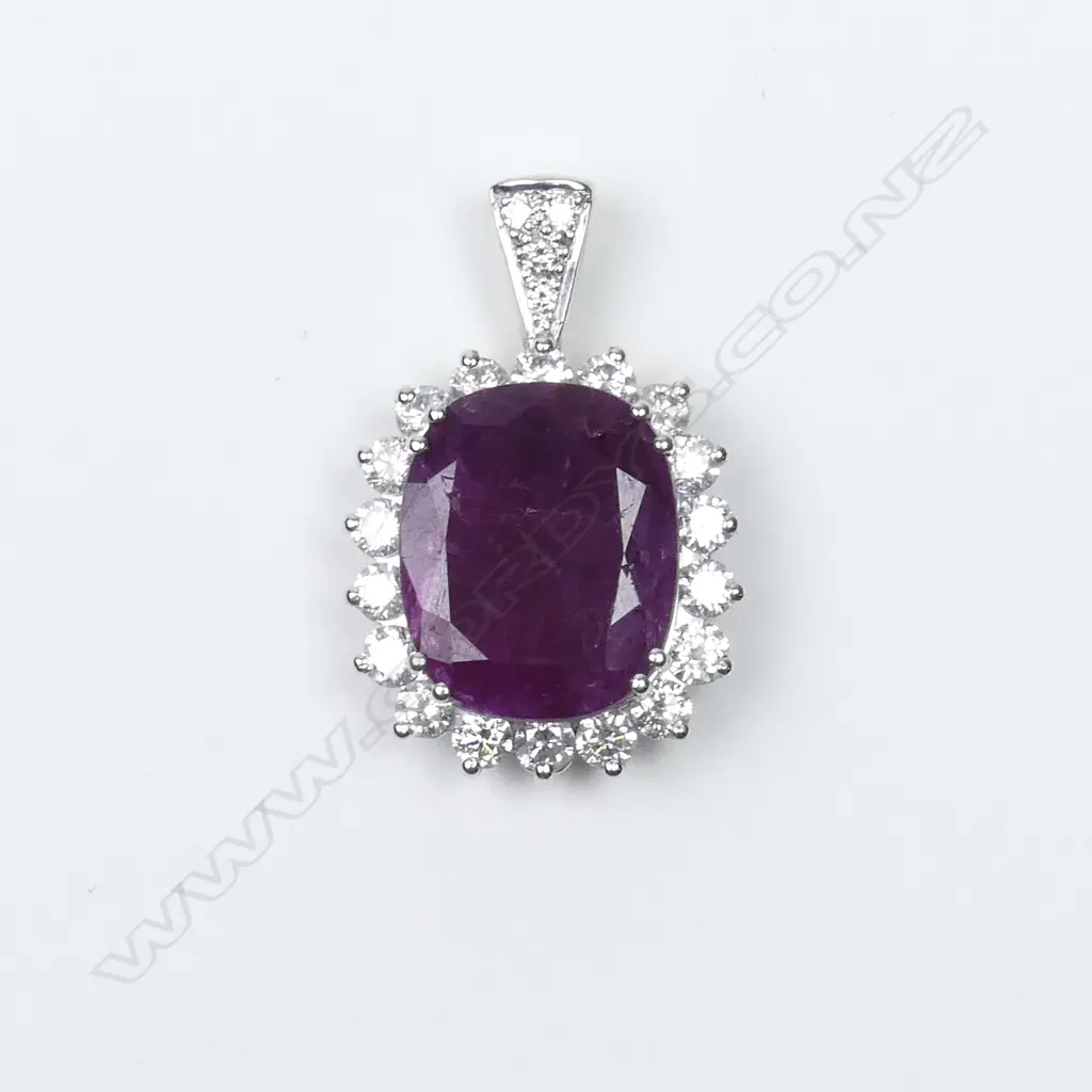 An 18ct white gold ruby and diamond pendant Image 1++