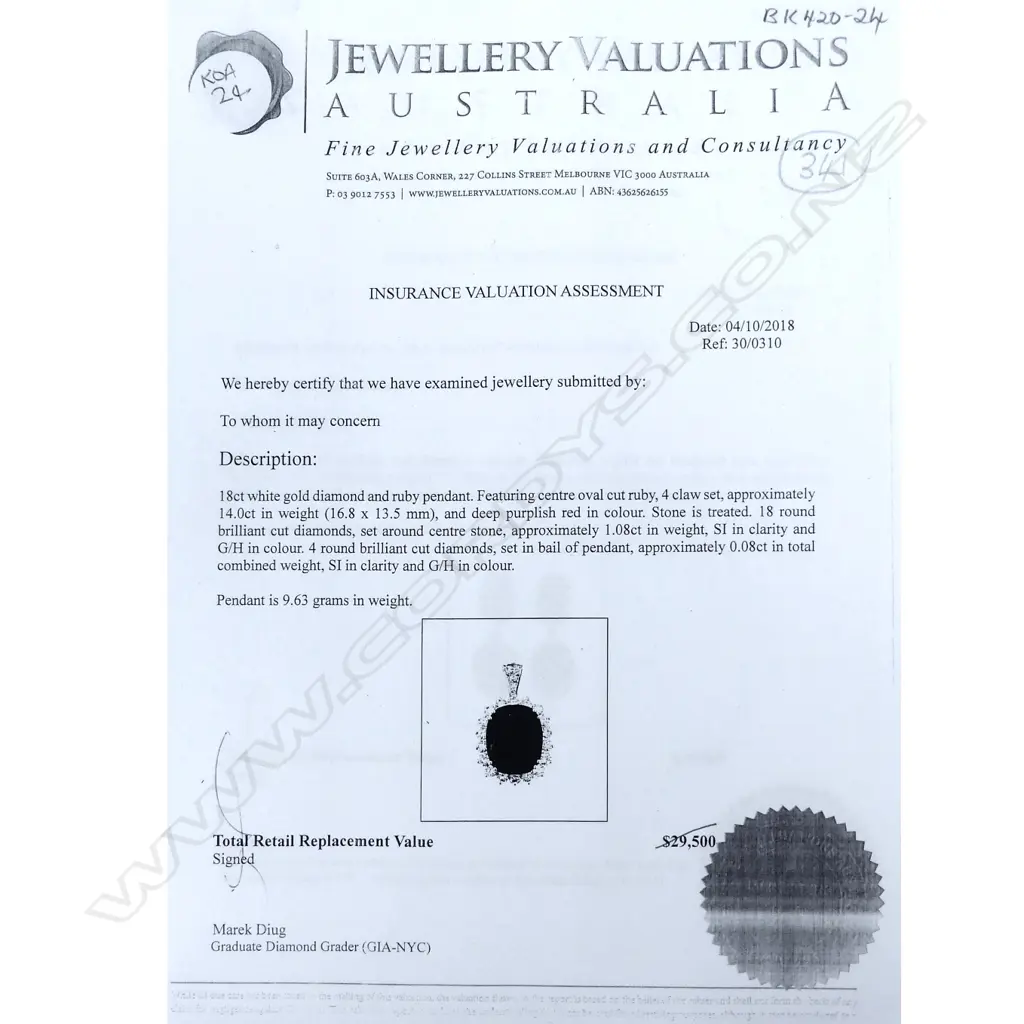 An 18ct white gold ruby and diamond pendant Image 1++