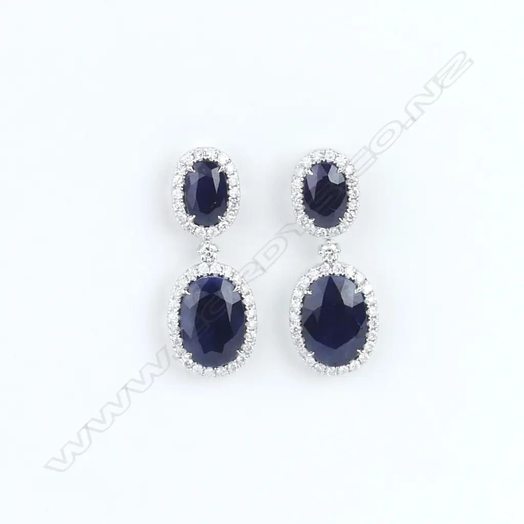 A pair of 18ct white gold sapphire and diamond earrings Image 1++