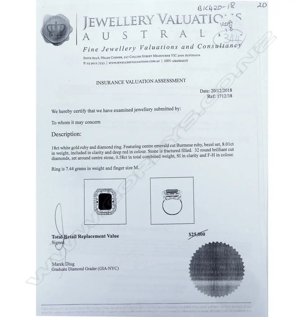 An 18ct white gold ruby and diamond dress ring Image 1++