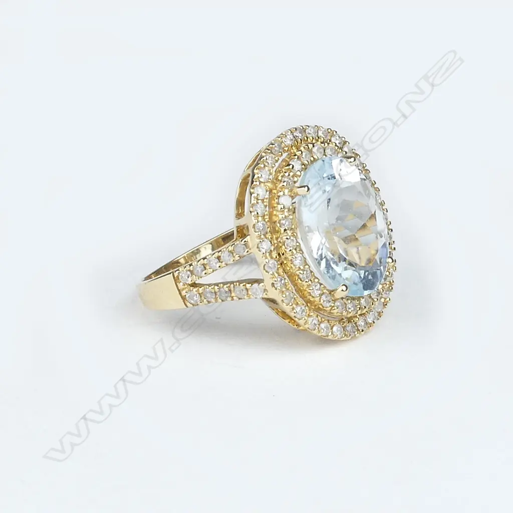 14ct yellow gold aquamarine and diamond halo ring Image 1++