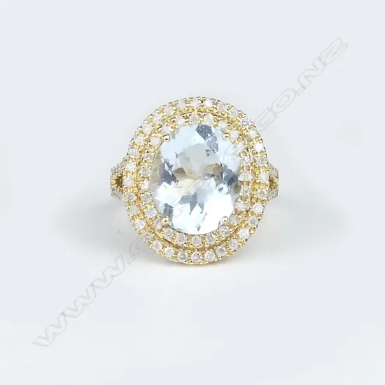 14ct yellow gold aquamarine and diamond halo ring