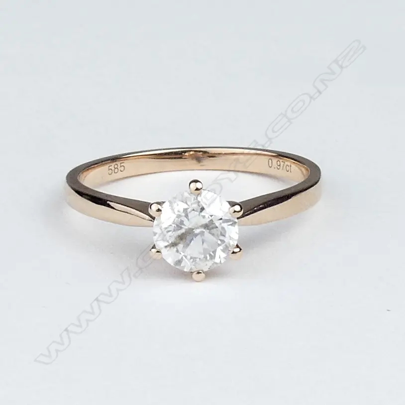 A 14ct rose gold diamond solitaire ring Image 1++