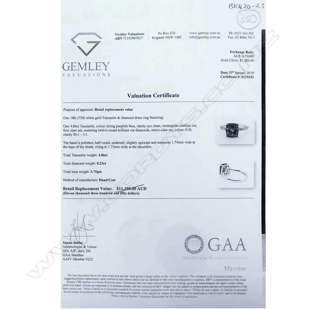 An 18ct white gold tanzanite and diamond ring Image 1++