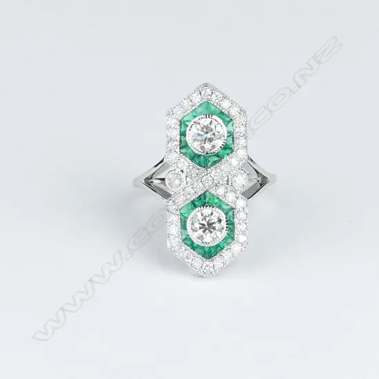 An 18ct. white gold emerald and diamond Art Deco style ring