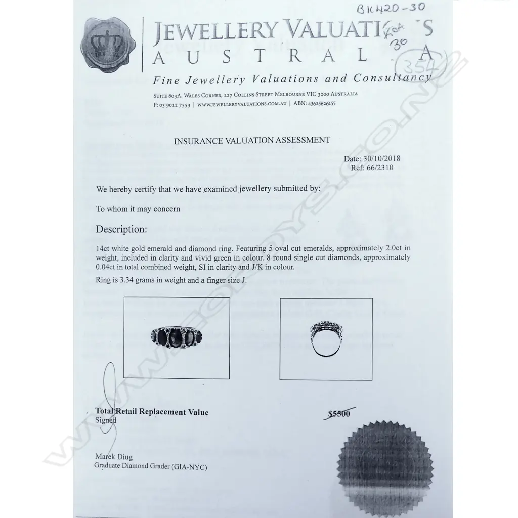 A 14ct white gold emerald and diamond ring Image 1++