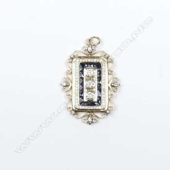 A 14ct yellow gold sapphire and diamond pendant