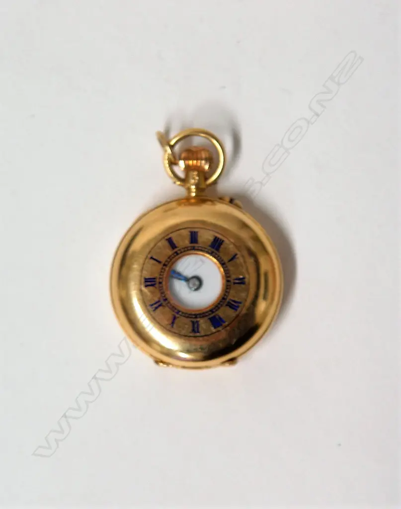 An 18ct. yellow gold lady's half hunter fob watch Image 1++