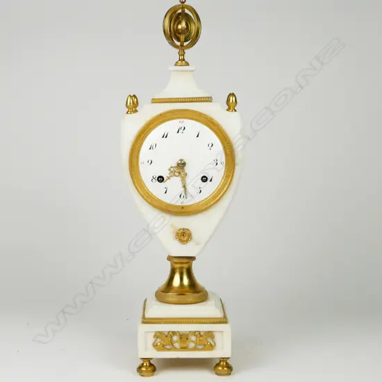 A French Empire marble vase shaped clock