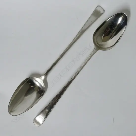 A pair of George III silver pie spoons