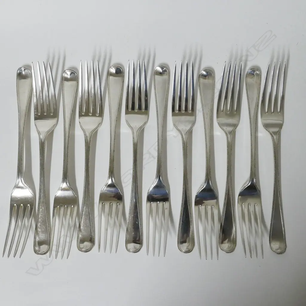 12 Georgian silver table forks Image 1++