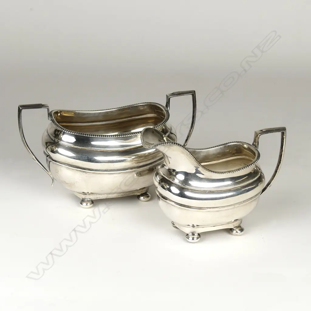 A Georgian Revival silver milk jug and sugar basin Image 1++