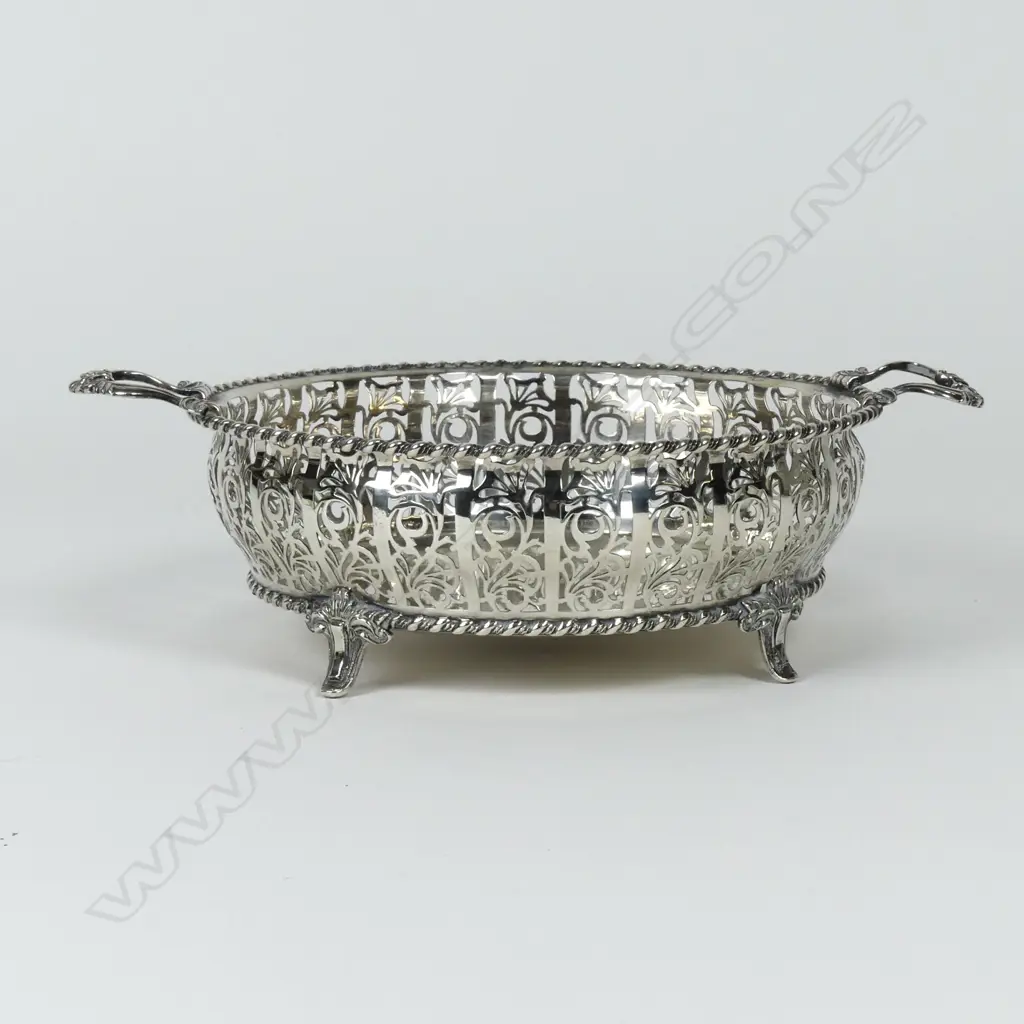 A silver two handled fruit bowl Image 1++