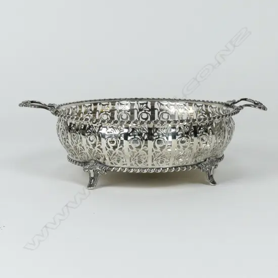 A silver two handled fruit bowl