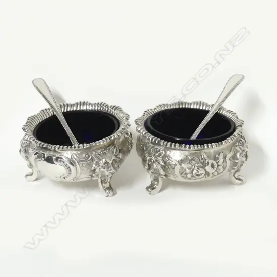 A pair of Victorian silver squat circular salts
