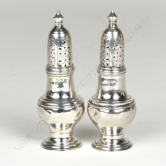 A pair of small Victorian vase shaped pepperettes