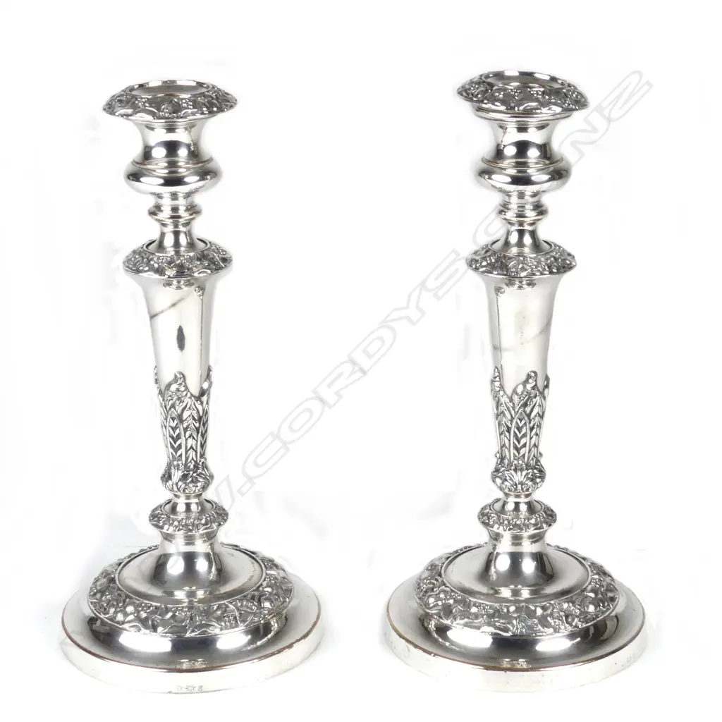 A pair of silver plate on copper column candlesticks Image 1++