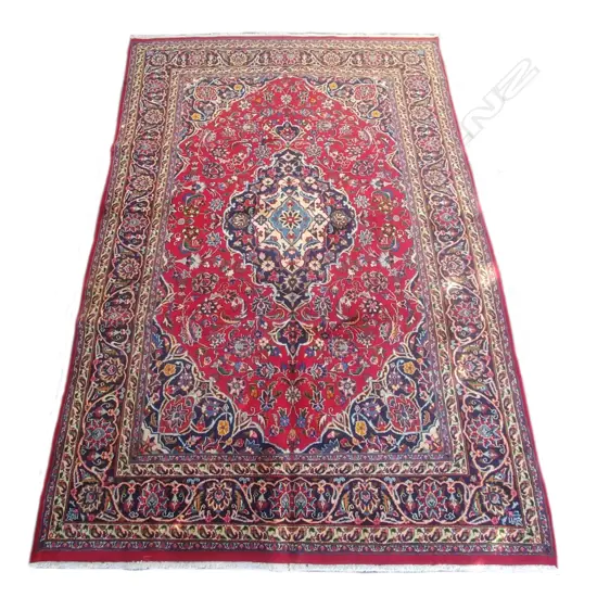 A large Persian Kashan hand knotted carpet