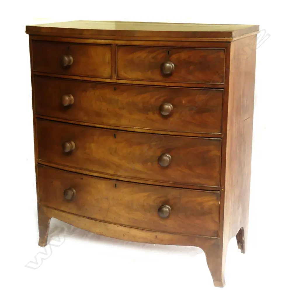 A Georgian mahogany five-drawer bowfront chest Image 1++