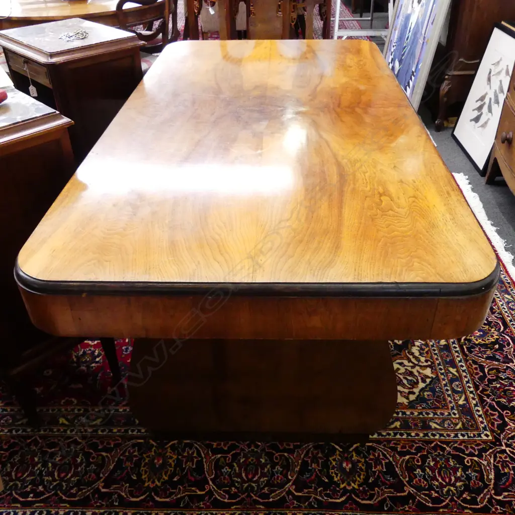 An Art Deco walnut dining table of classic Odeon style Image 1++