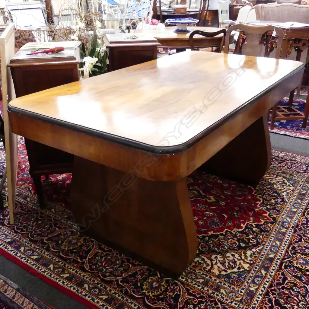 An Art Deco walnut dining table of classic Odeon style Image 1++