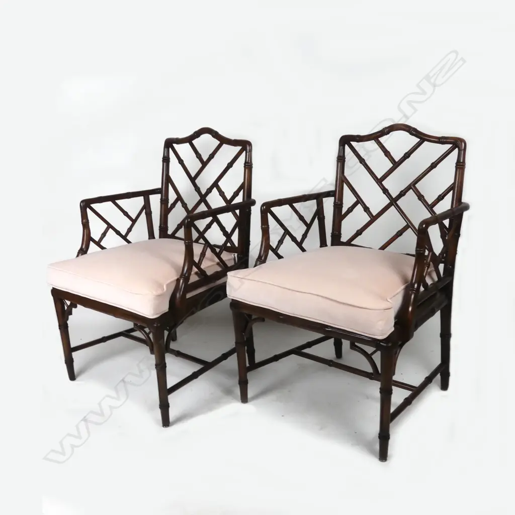 A pair of reproduction mahogany Chippendale style open elbow chairs Image 1++