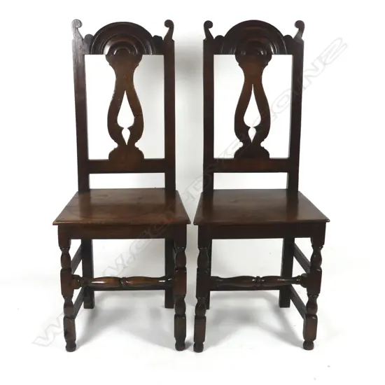 A pair of Victorian oak hall chairs