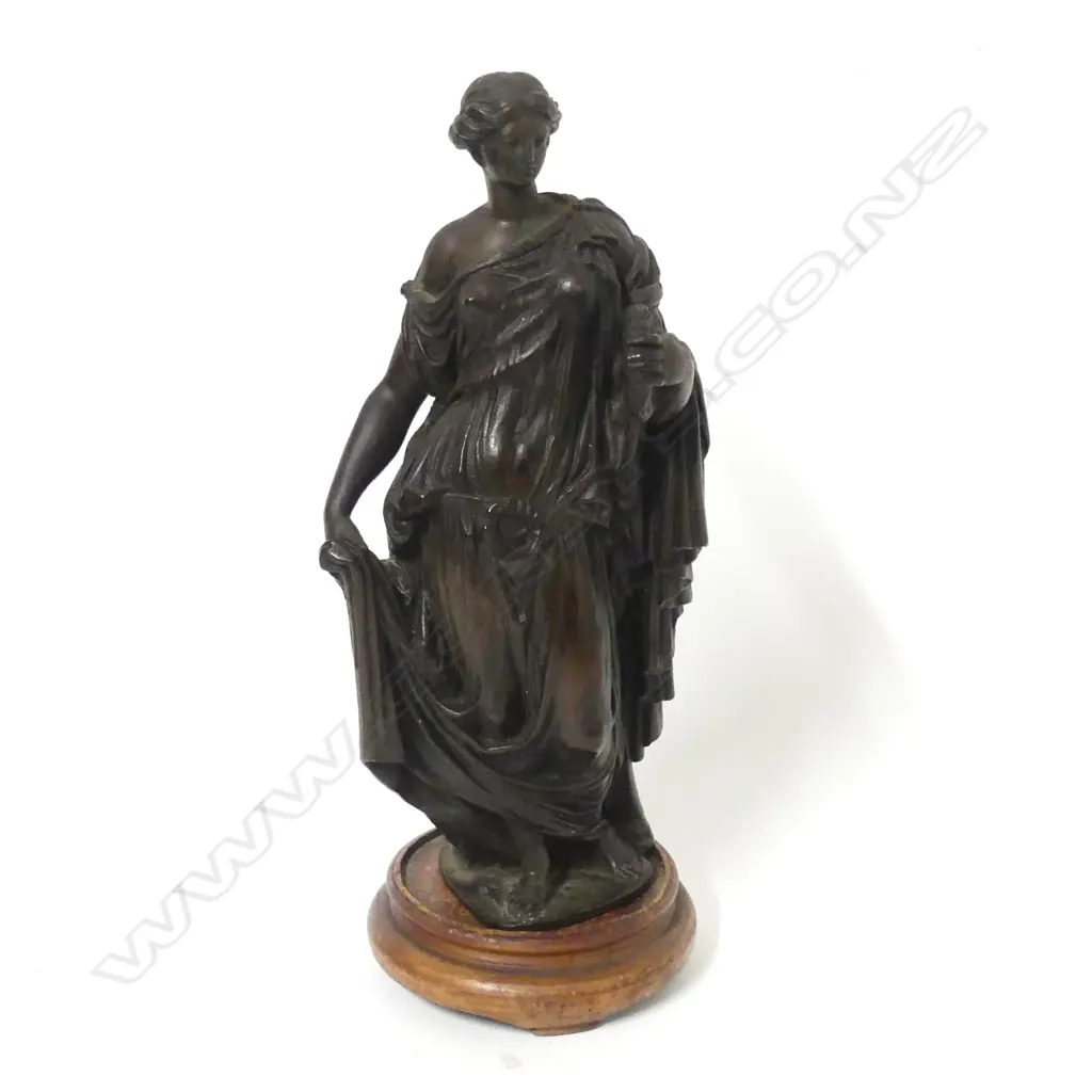 A small bronze statuette of a woman representing Victory Image 1++