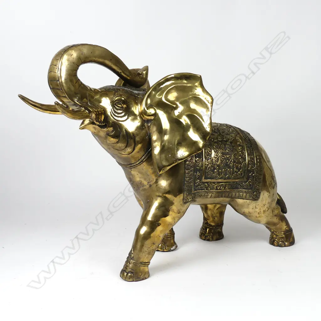 A large gilded bronze figure of a standing elephant Image 1++