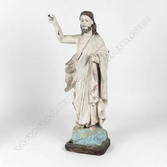 A vintage painted wood statue of Jesus