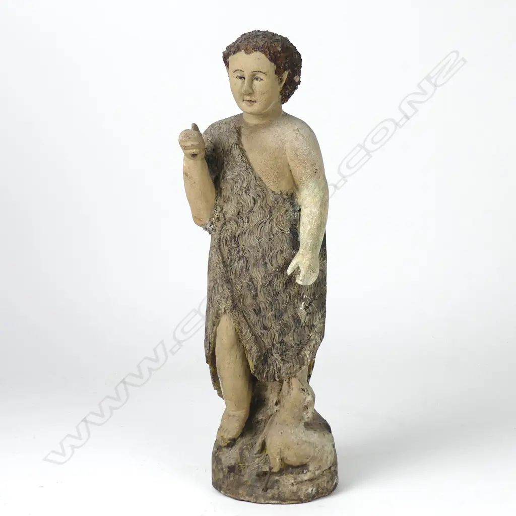 A naive carved wooden statue of St John the Baptist Image 1++