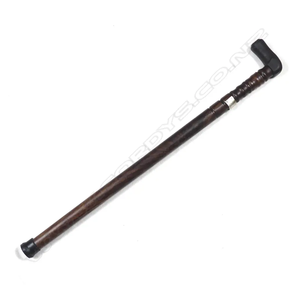 A sturdy turned mahogany walking stick Image 1++