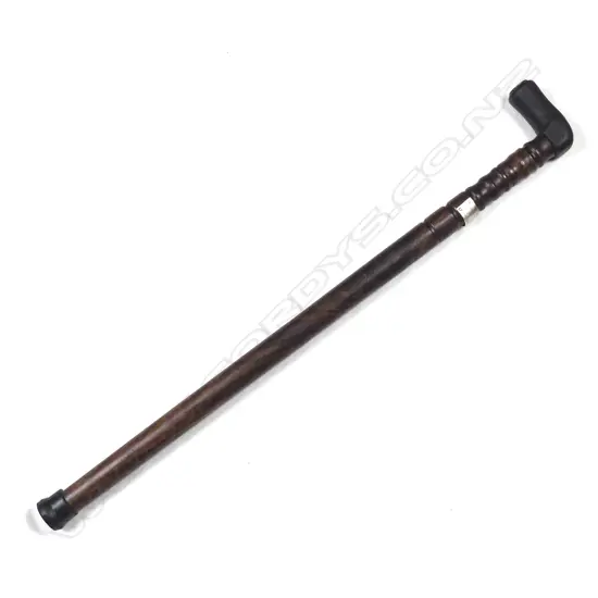 A sturdy turned mahogany walking stick