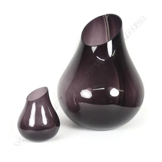 A pair of graduated sized glass vases