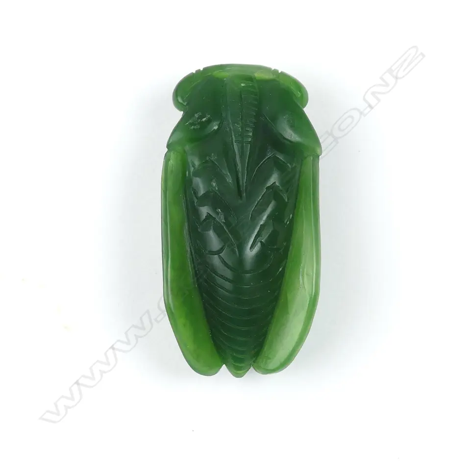 A Chinese deep green jade finely carved cicada pendant Image 1++