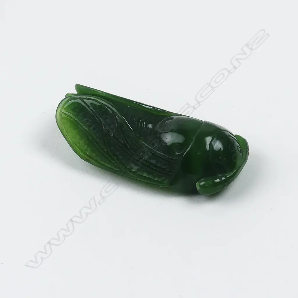 A Chinese deep green jade finely carved cicada pendant Image 1++
