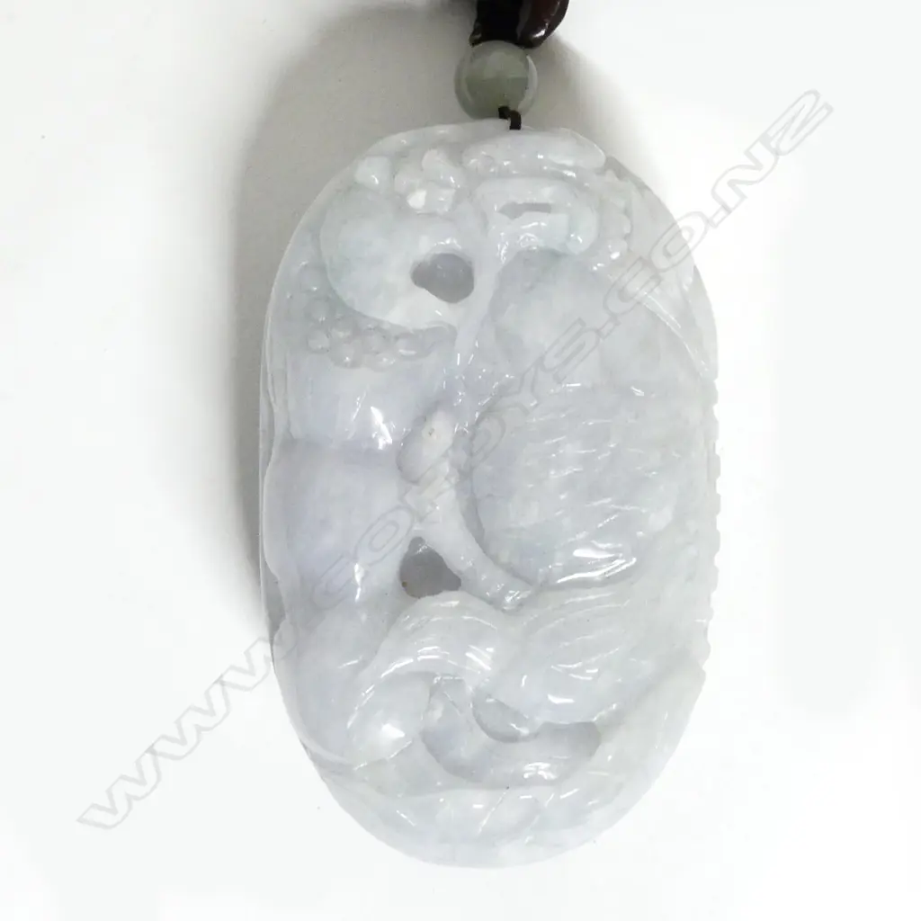 A Chinese mottled grey-white jade handling piece Image 1++