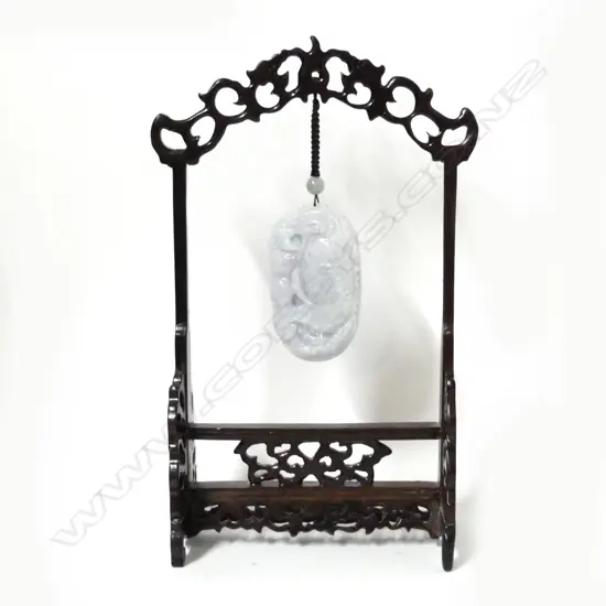 A Chinese mottled grey-white jade handling piece