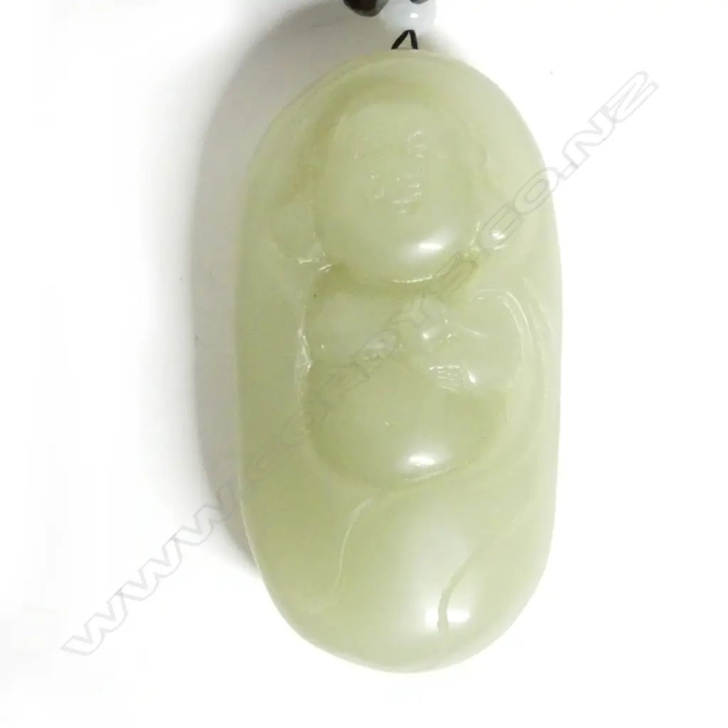 A Chinese pale green jade handling piece Image 1++