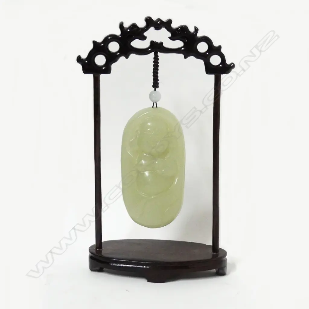 A Chinese pale green jade handling piece Image 1++