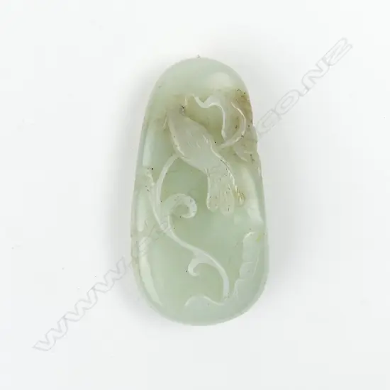 A Chinese pale jade carved small boulder