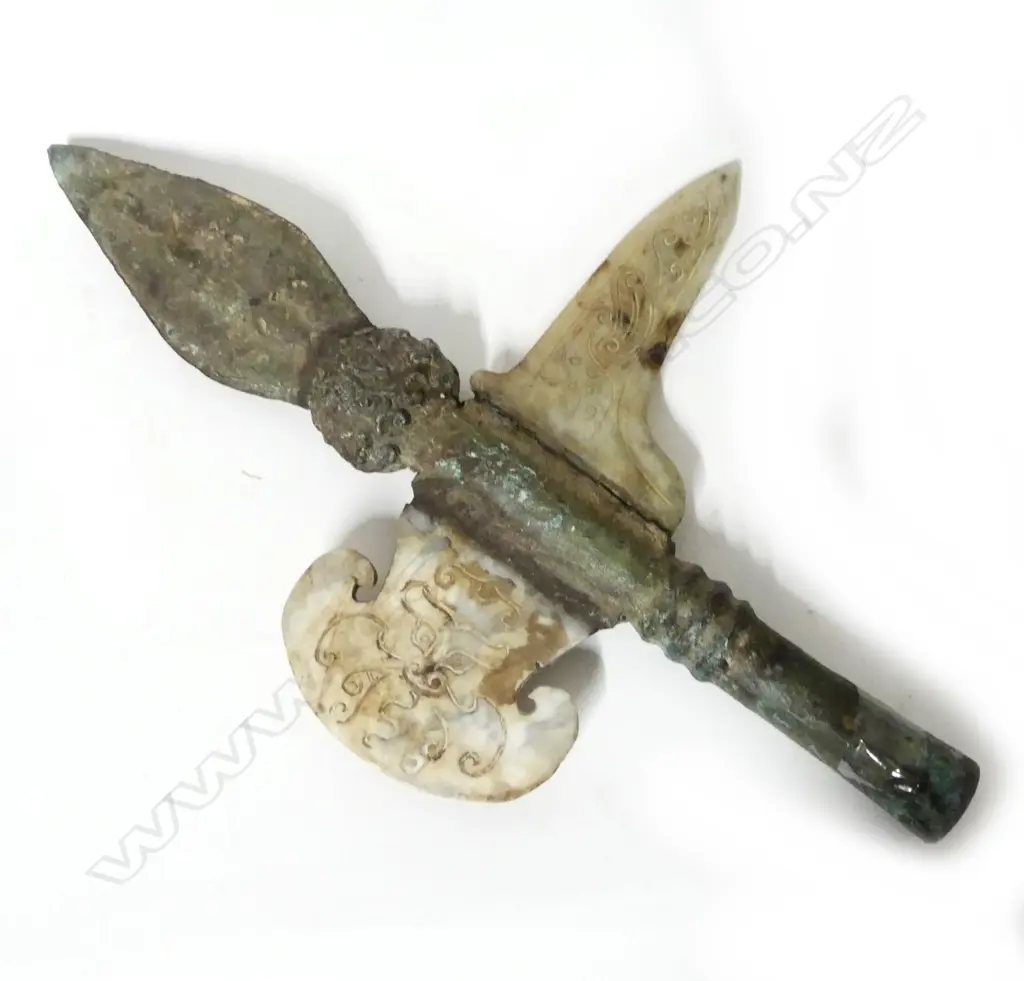 A metal and stone replica of an archaic Chinese halberd head Image 1++