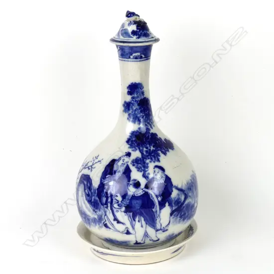 A Japanese Arita carafe and cover with saucer