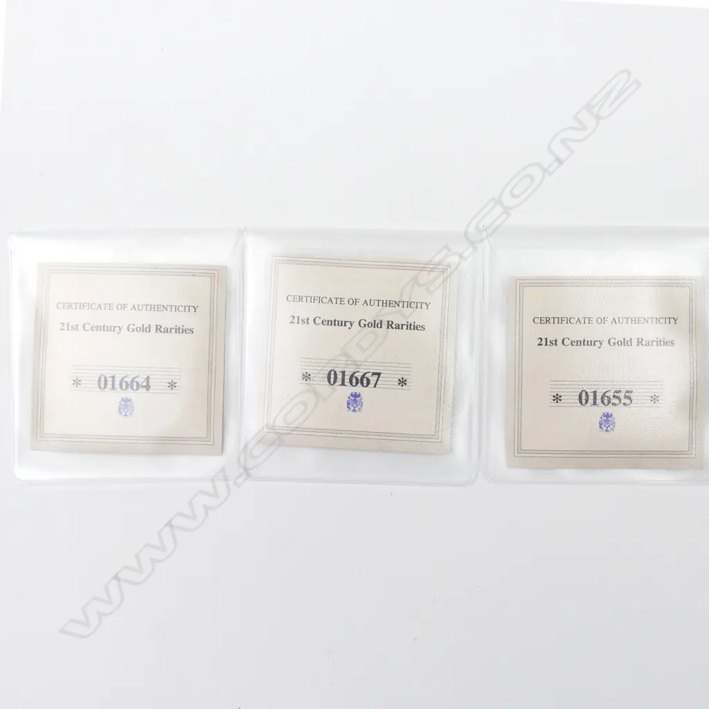 Three 14ct gold miniature krugerands Image 1++