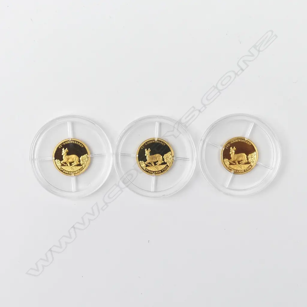 Three 14ct gold miniature krugerands Image 1++