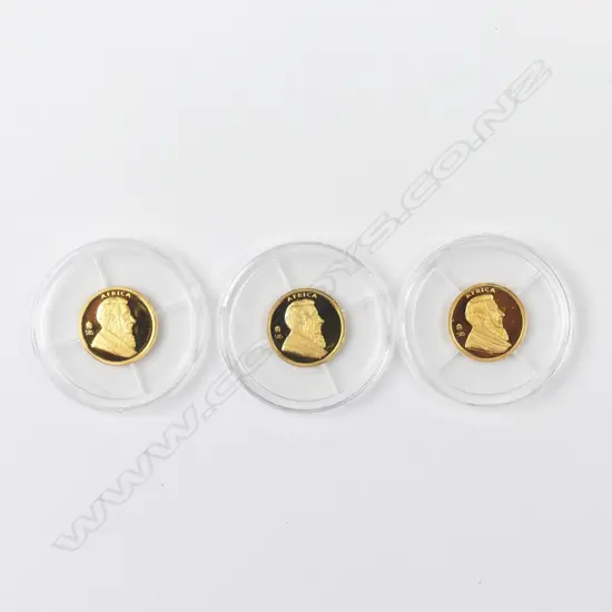 Three 14ct gold miniature krugerands
