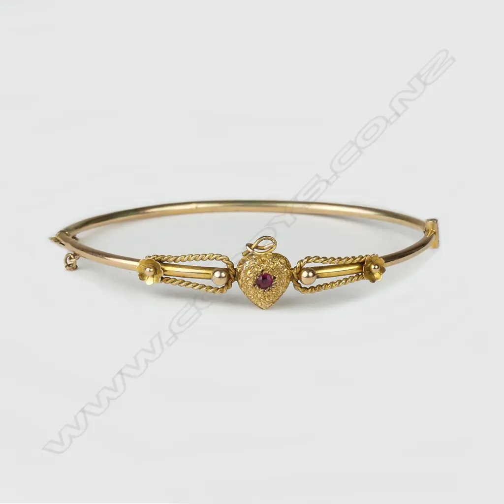 An Edwardian 9ct. gold half-hinged bangle Image 1++